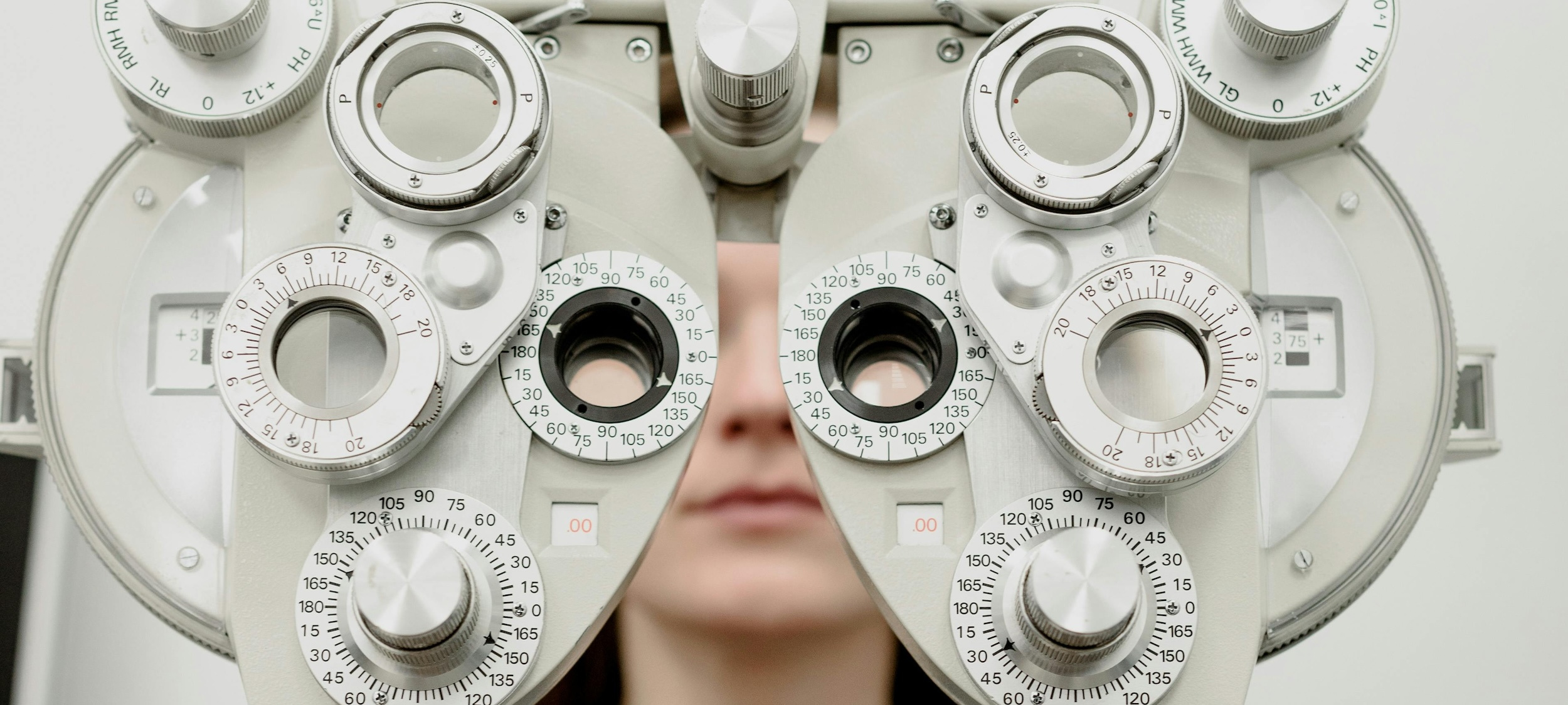 Patient looks through an ophthalmoscope.