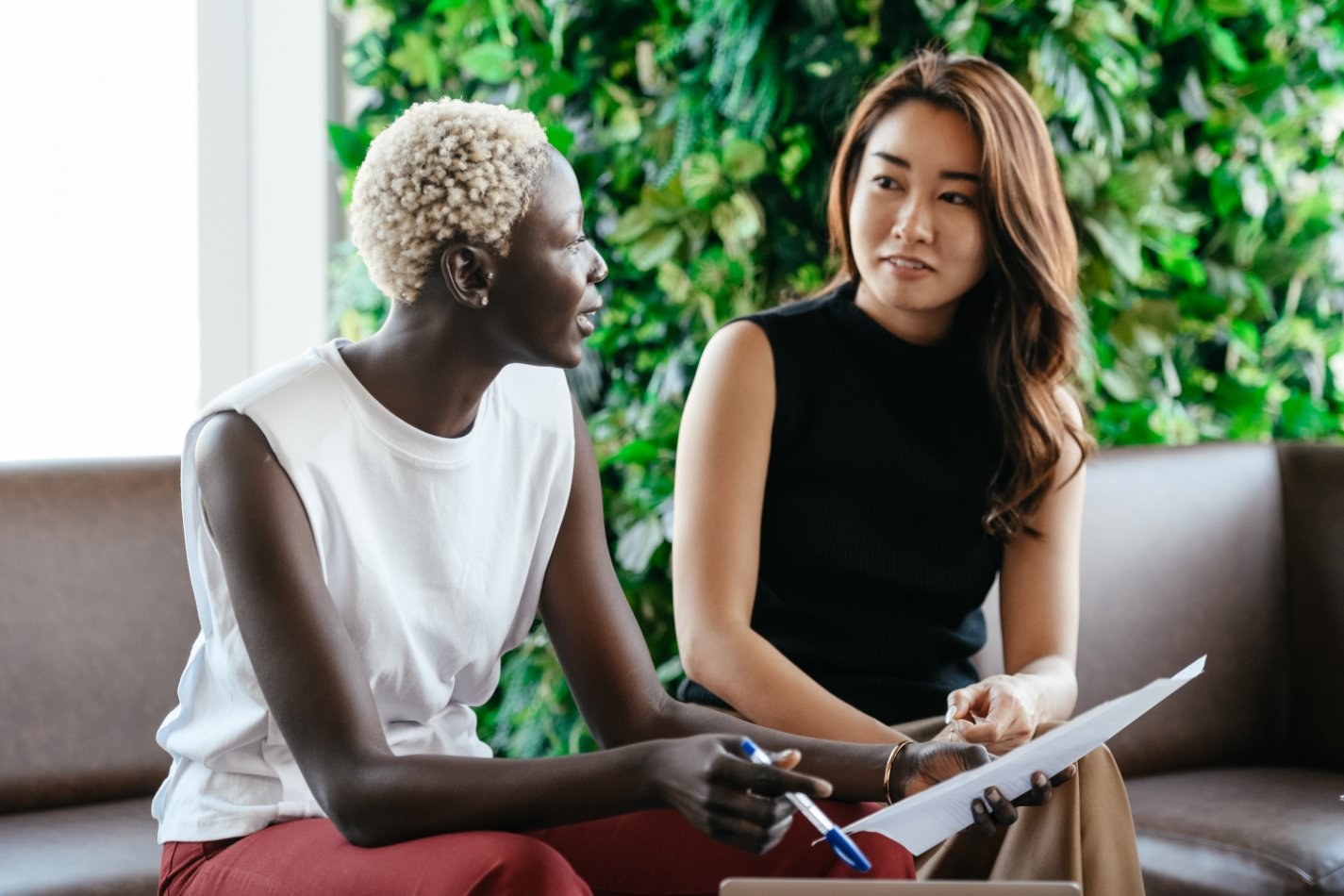 coworkers talking on a couch