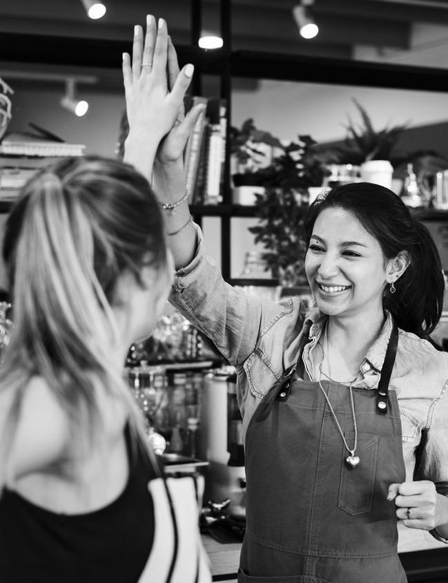 co-workers giving each other a high five