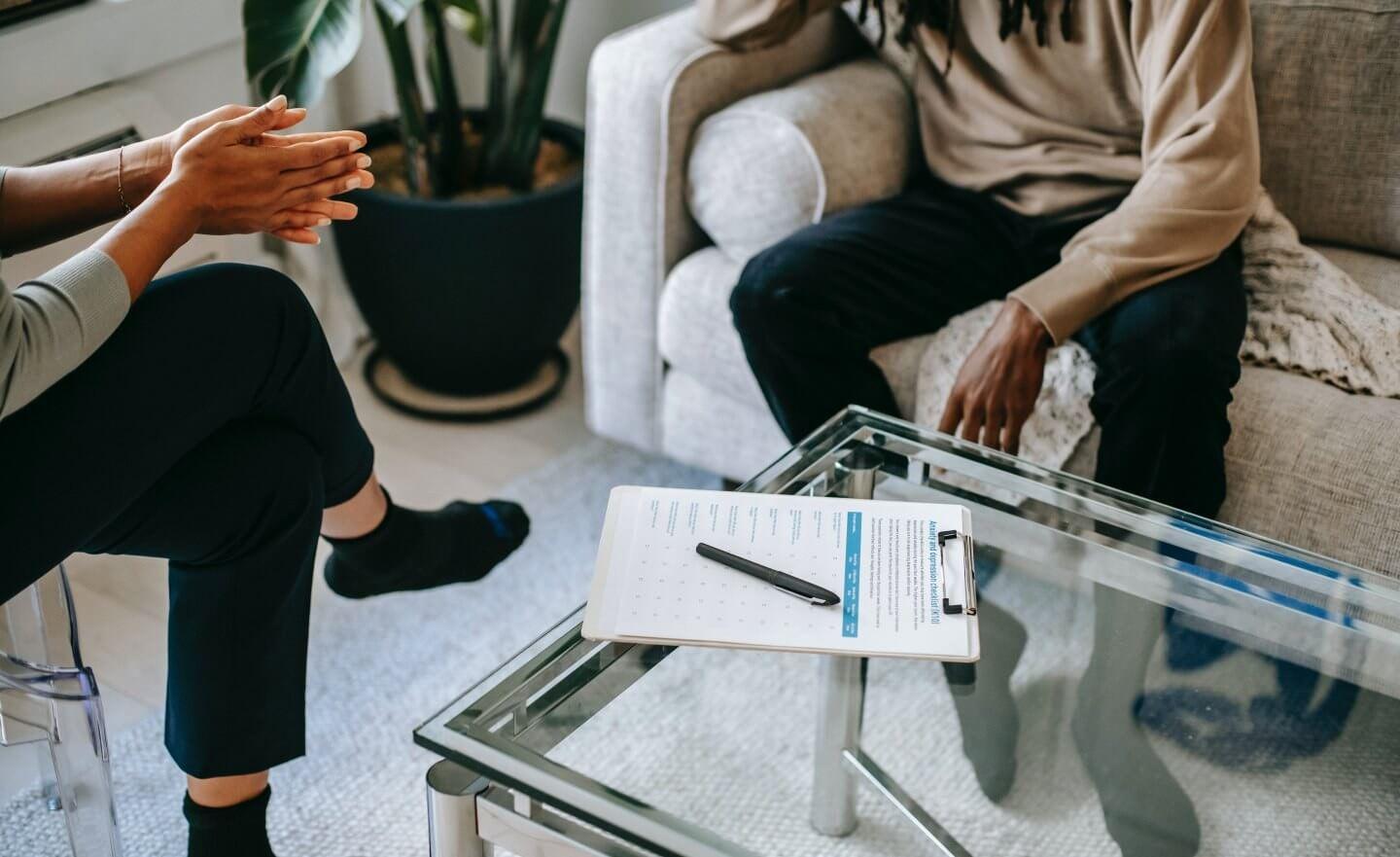 Two people sitting down having a conversation