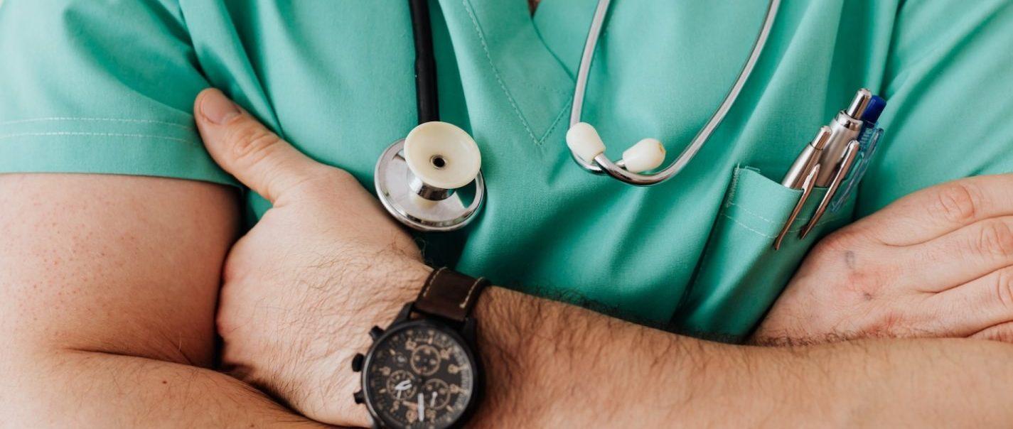 Male doctor with arms crossed