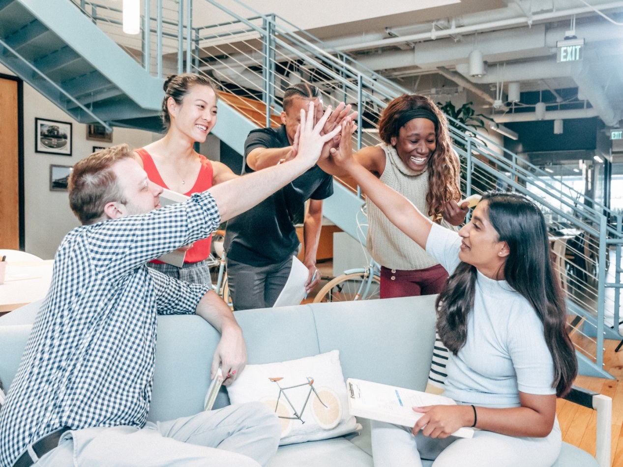 Team of people high five