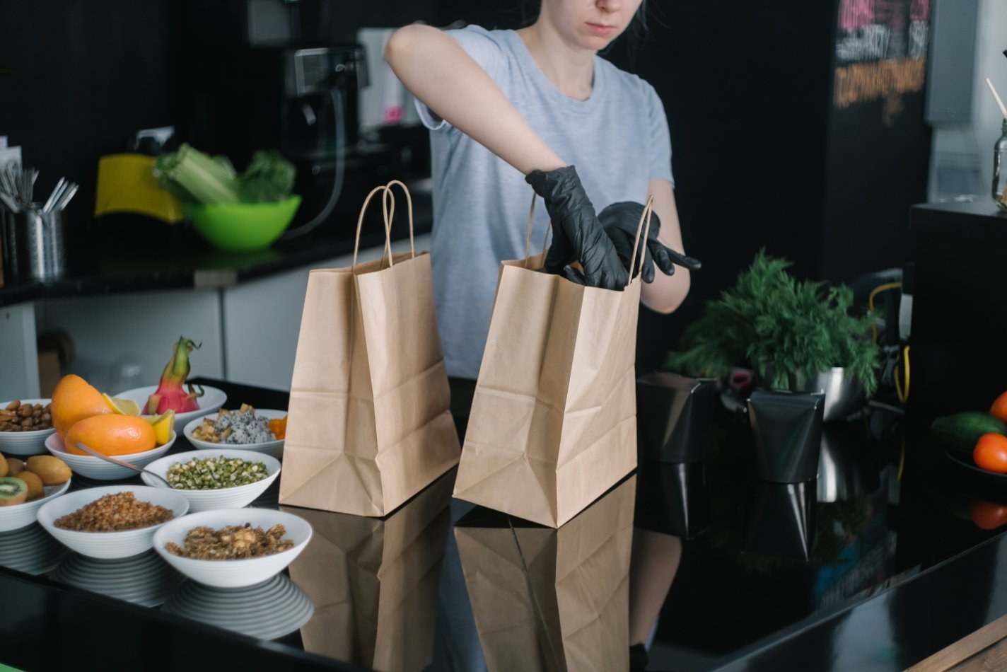 Person putting food into bags