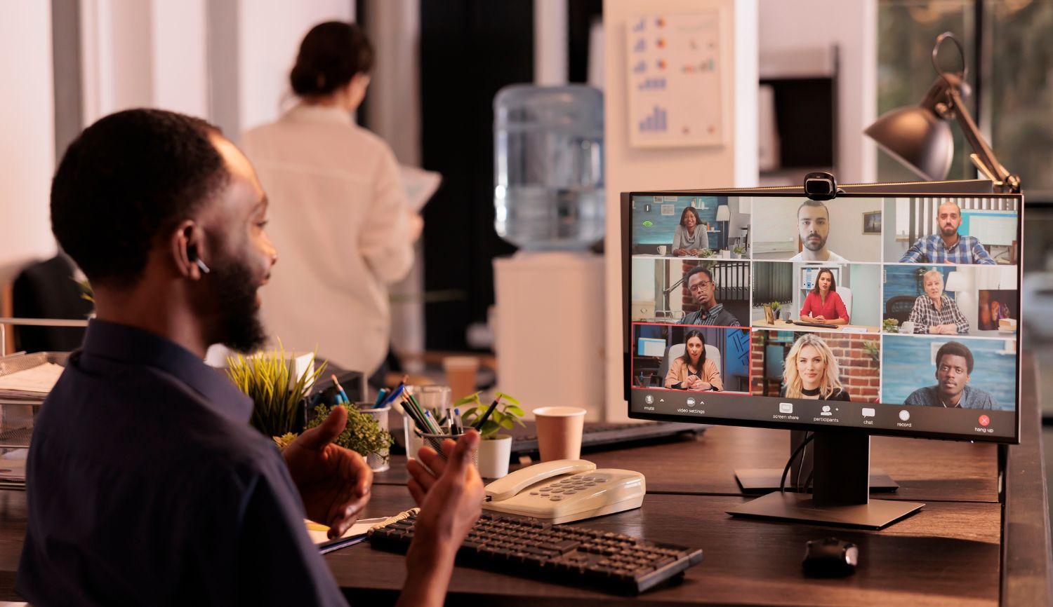 Employee on video call with remote colleagues