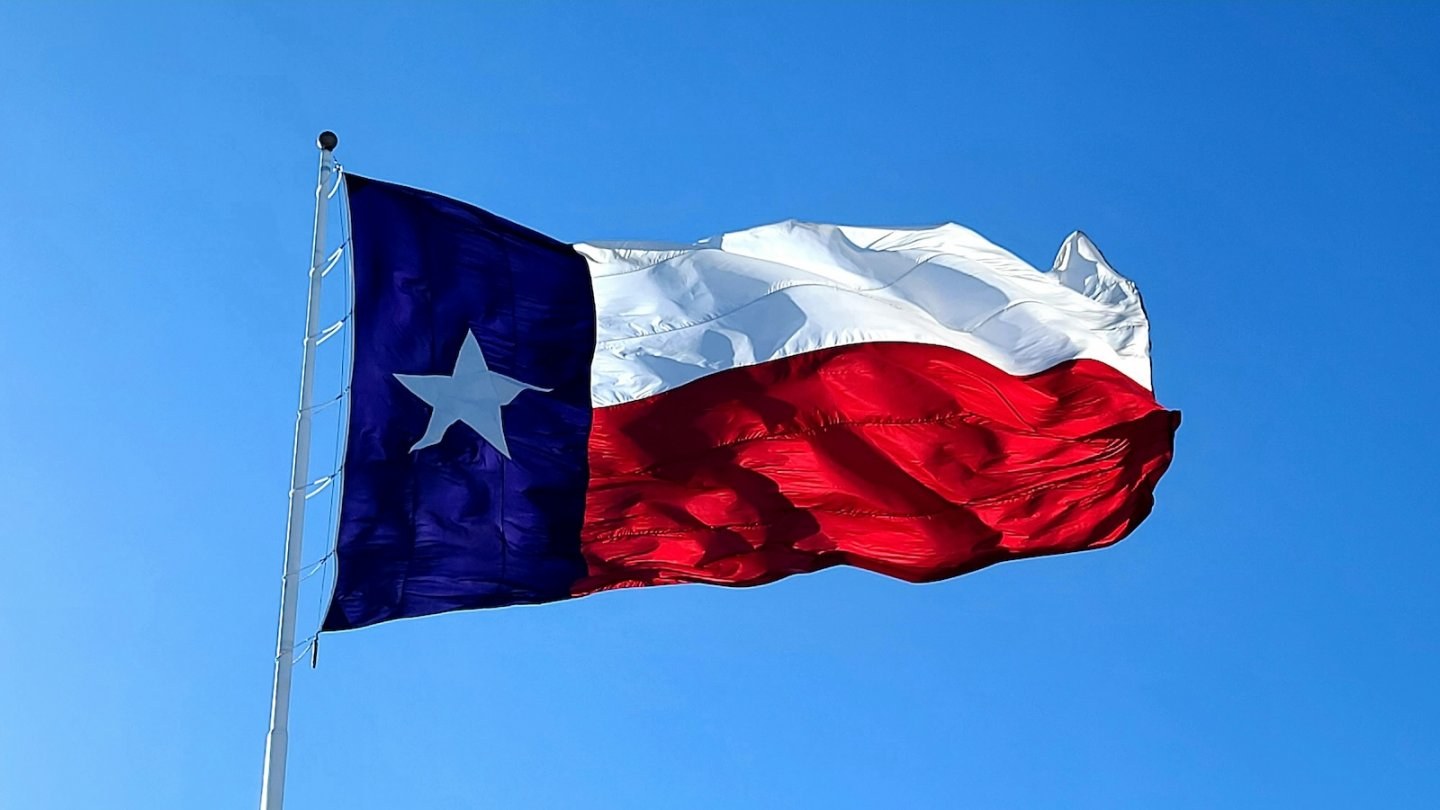 Flying Texas state flag blows in the wind